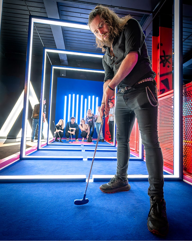 Woman playing mini-golf