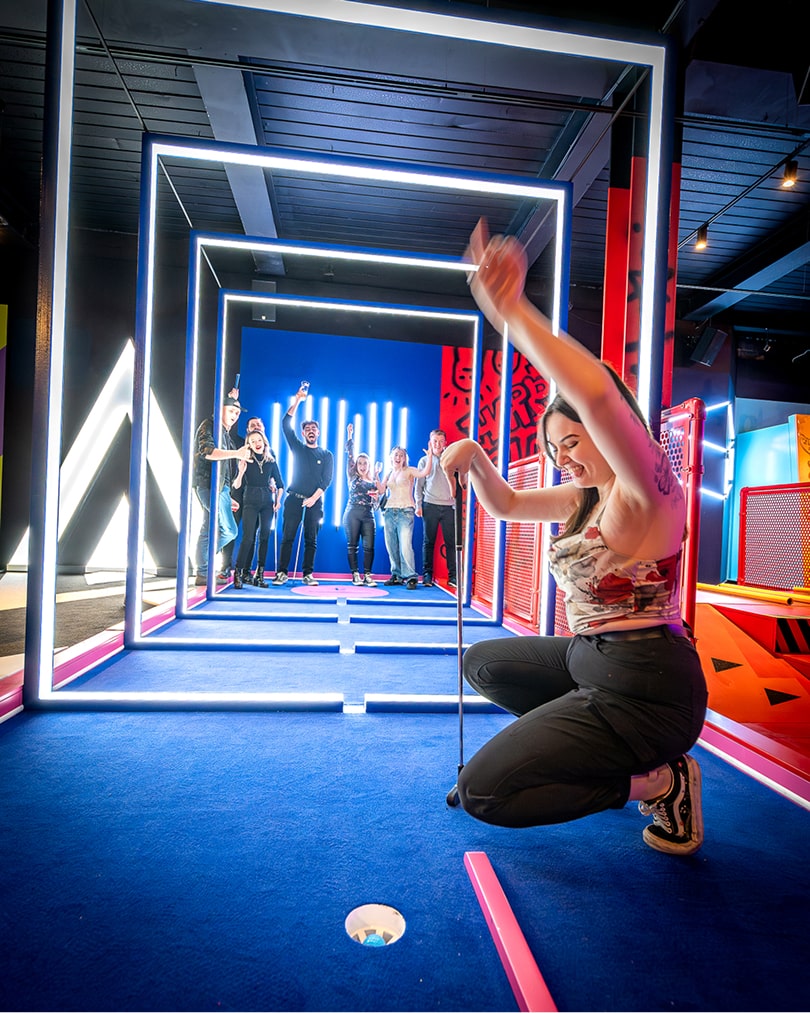 Woman playing mini-golf